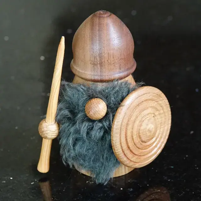 picture of a wooden "gonk" persona, showing bottle opener