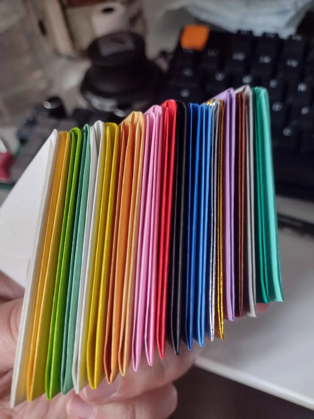 picture of a stack of folded colourful modules