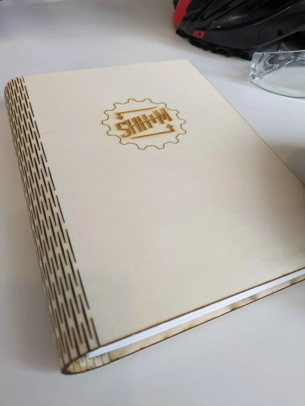 picture of book with wooden laser cut book cover