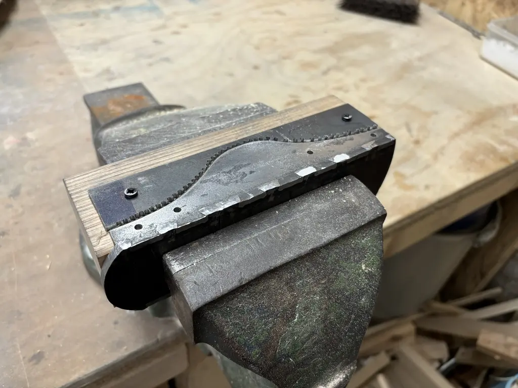 picture of partly made wood plane, metal bit