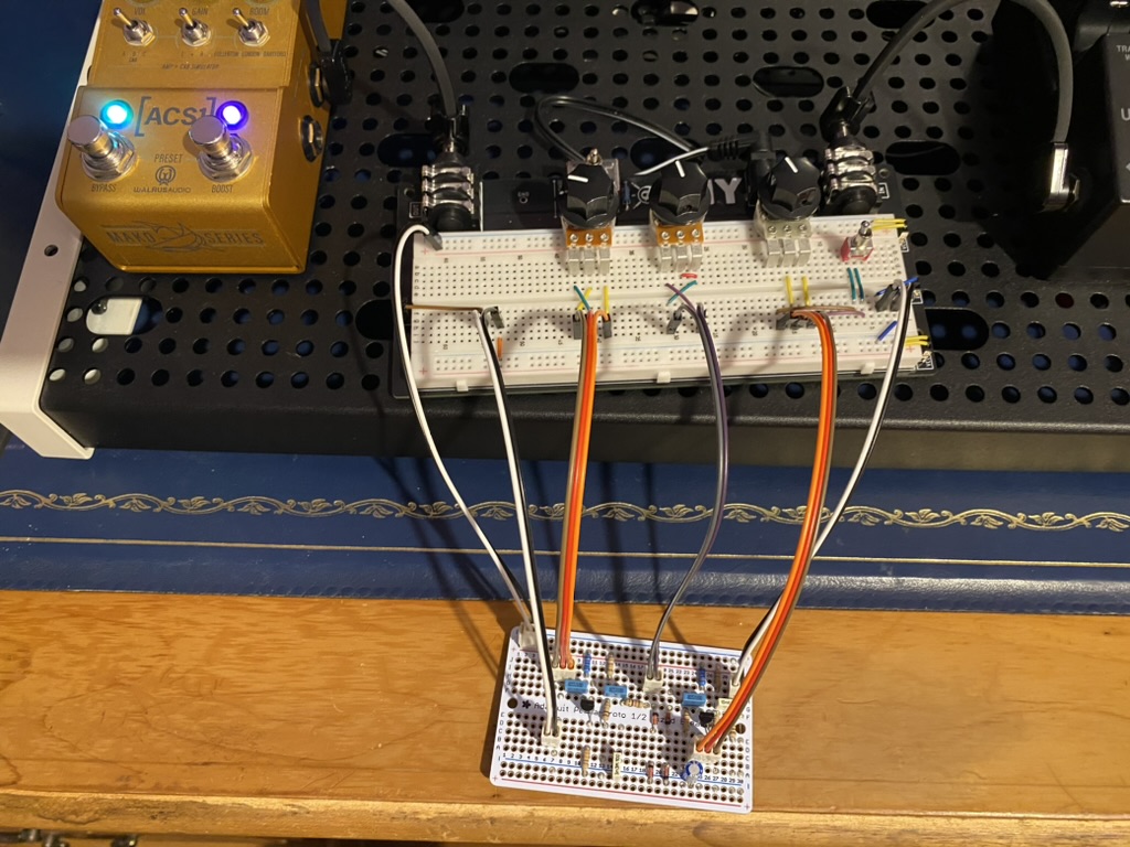 Picture of two electronic boards connected together with jumper cables